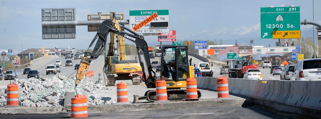 Al Hartmann | The Salt Lake Tribune
With 150 road projects for 2016 UDOT is encouraging safe driving around construction areas. Cars go by at over 70 mph near road construction between 12300 South and Bangerter Highway exits on I-15 Tuesday April 12. Often orange barrels or a concrete barrier is the only thing protecting road workers from traffic passing by only 3 feet away.