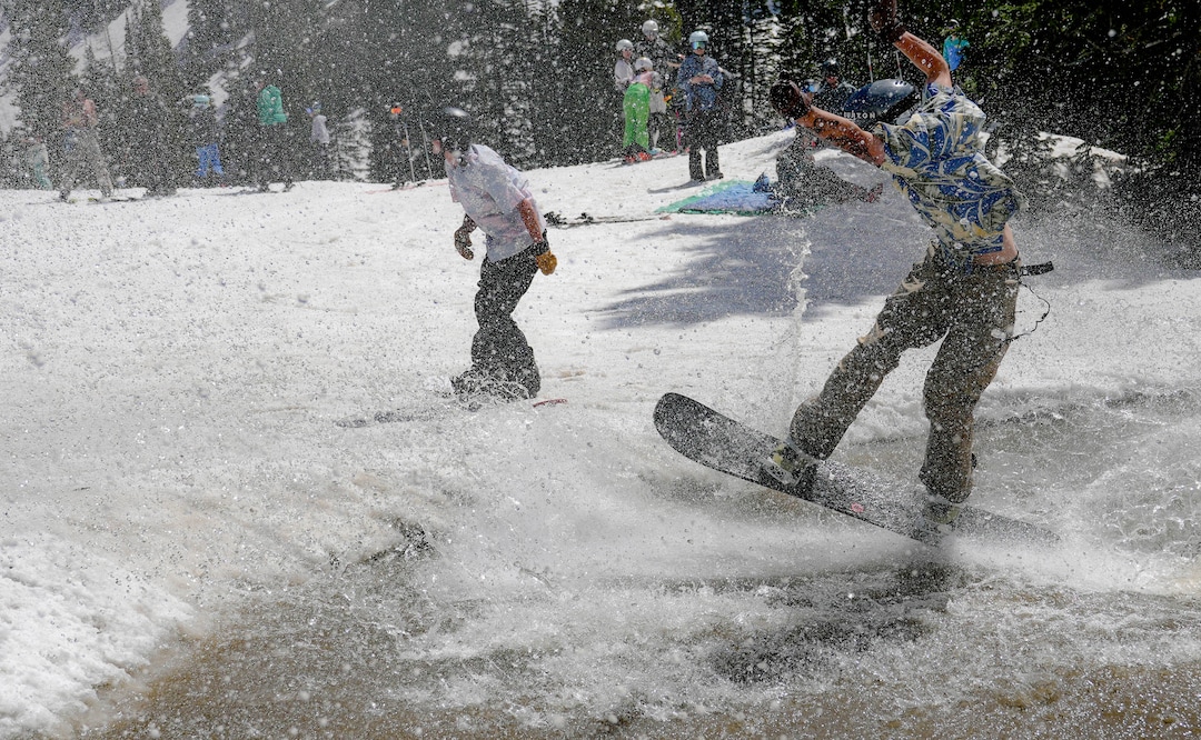 (Francisco Kjolseth  | The Salt Lake Tribune) A party atmosphere forms at the pond in Peruvian Gulch as Snowbird closes the book on the 2024-25 ski season on Monday, May 26, 2025. Snow and sun revelers took to the slushy slopes on Memorial Day as the resort was the last in the state to close.