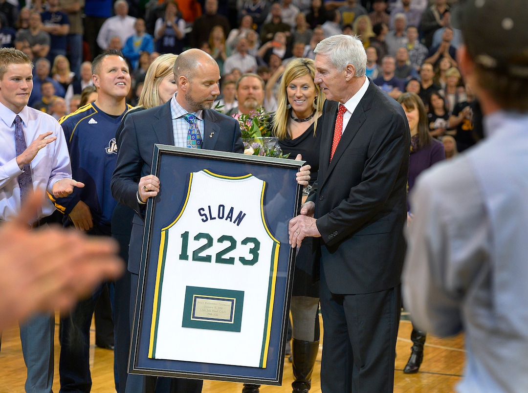 (Scott Sommerdorf   |  Tribune file photo) Steve Miller hands Jerry Sloan a commemorative jersey noting his total NBA victories as he was honored during halftime as the Jazz hosted the Golden State Warriors, Friday, Jan. 31, 2014. 