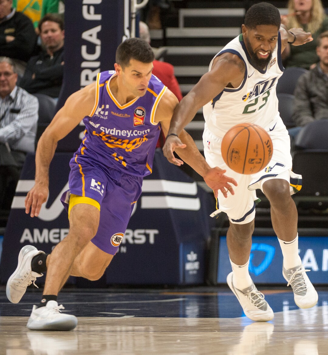 (Rick Egan  |  The Salt Lake Tribune)Utah Jazz forward Royce O'Neale (23) goes for the ball along with Sydney Kings guard Kevin Lisch (11), in preseason basketball Utah Jazz vs.Sydney Kings, in Salt Lake City, Sunday, October 2, 2017.
