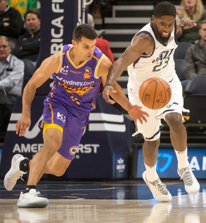 (Rick Egan  |  The Salt Lake Tribune)Utah Jazz forward Royce O'Neale (23) goes for the ball along with Sydney Kings guard Kevin Lisch (11), in preseason basketball Utah Jazz vs.Sydney Kings, in Salt Lake City, Sunday, October 2, 2017.


