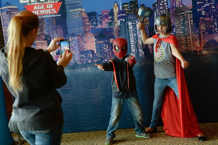 (Francisco Kjolseth  |  The Salt Lake Tribune)  Jillian Schouten takes a picture of her kids Jack, 6, and Sienna, 9, as Utah-based military families gather for the Salt Lake opening night of the all-new Marvel Universe LIVE! Age of Heroes, witnessing their favorite Marvel super heroes, including The Avengers, Spider-Man and the Guardians of the Galaxy in an action-packed adventure at the Maverik Center on Thursday, Sept. 28, 2017. MarvelÕs greatest military Super Hero Captain America was partnered with Got Your 6, a military veteran non-profit group dedicated to empowering veterans to lead and build stronger communities across America.