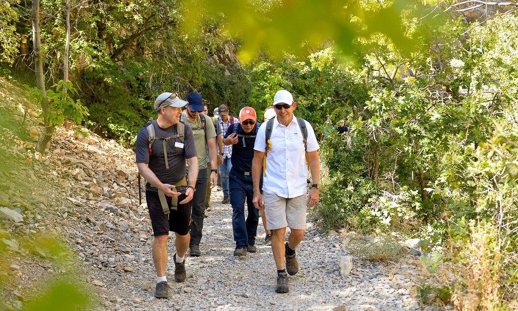 (Chris Samuels | The Salt Lake Tribune) U.S. Rep. John Curtis talks with Tom Moyer, of the Citizens’ Climate Lobby, while leading climate scientists and constituents on a hike in Rock Canyon in Provo, Monday, Sept. 26, 2022.