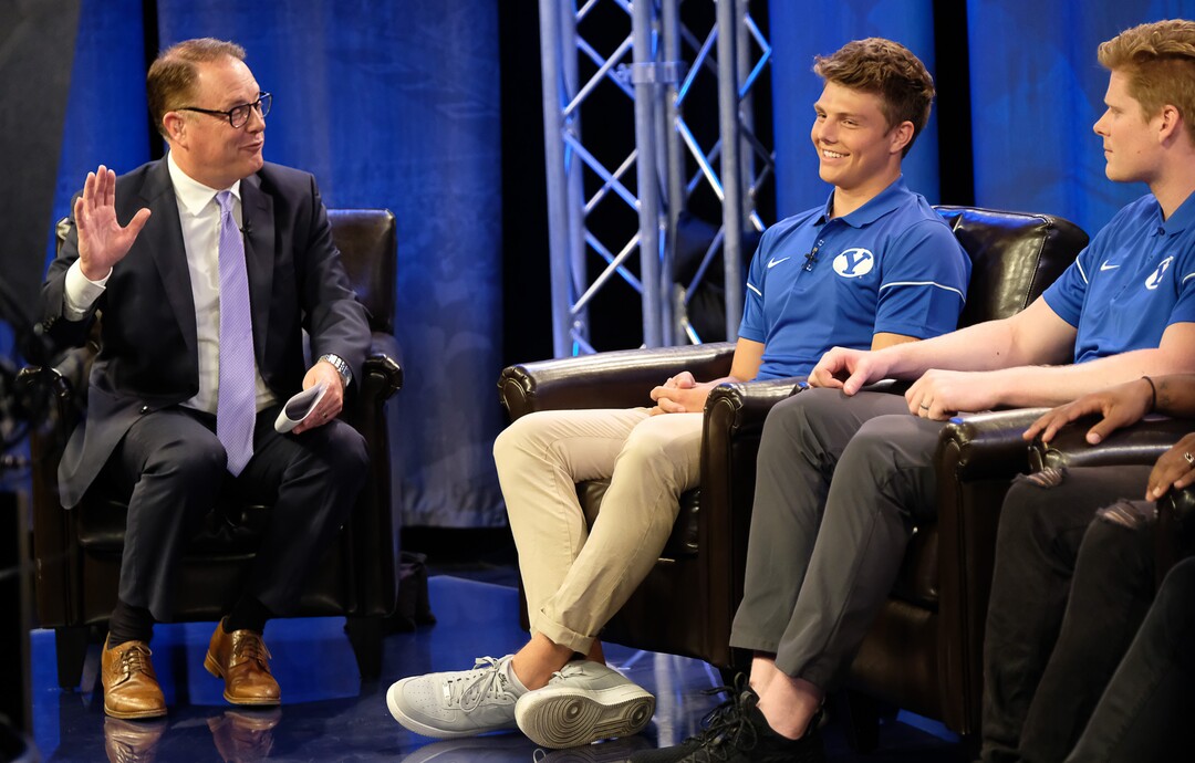 (Francisco Kjolseth  |  The Salt Lake Tribune)  Dave McCann interviews BYU quarterback Zach Wilson, center, and tight end Matt Bushman during a live broadcast on BYUTV during BYU football media day at the BYU Broadcasting Building in Provo on Tuesday, June 18, 2019.