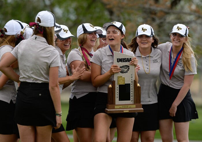 (Francisco Kjolseth  |  The Salt Lake Tribune)  Lone Peak celebrates their team title as Lauren Taylor holds the trophy on day two of the Class 6A girls' golf state tournament at Meadow Brook Golf Course in Taylorsville on Tuesday, May 15, 2018.