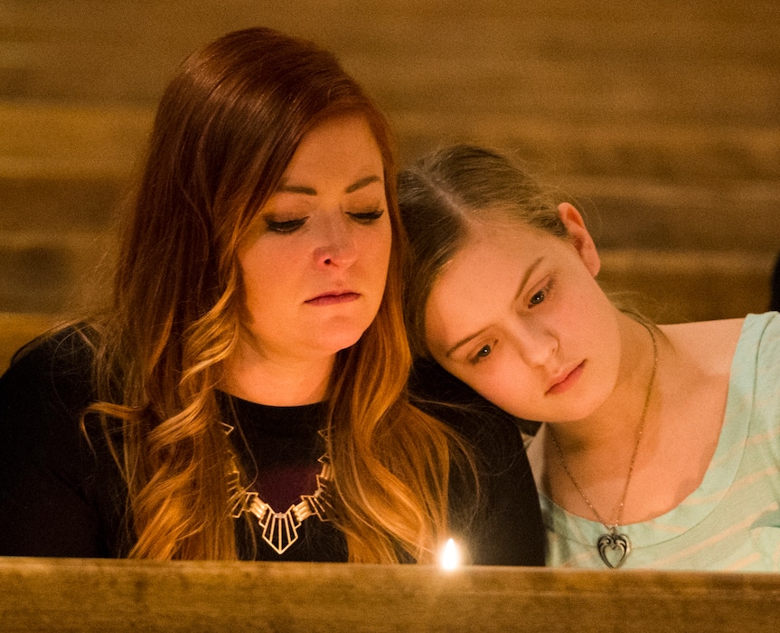 Rick Egan  |  The Salt Lake TribuneAlison Spencer and Morgan Miller light a candle as mourners and survivors  held a vigil to mark the 10th anniversary of the Trolley Square shootings at Zion Evangelical Lutheran Church, Sunday, February 12, 2017.