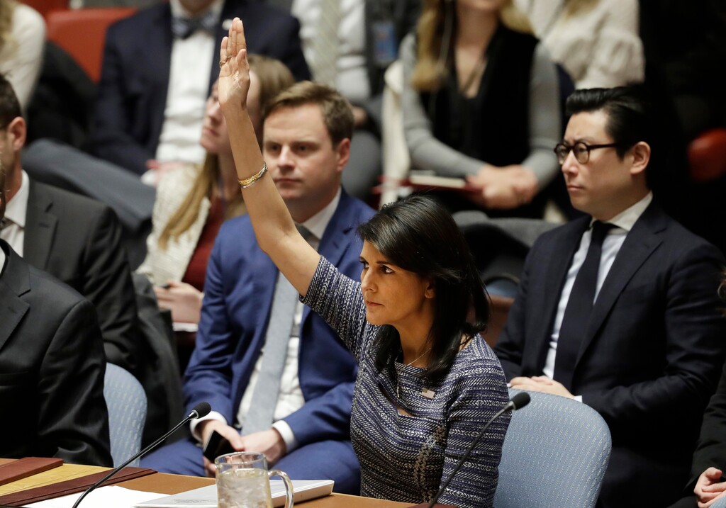 (Mark Lennihan | The Associated Press) U.S. Ambassador Nikki Haley votes in favor of a resolution, Friday, Dec. 22, 2017, at United Nations headquarters. The Security Council is voting on proposed new sanctions against North Korea, including sharply lower limits on its refined oil imports, the return home of all North Koreans working overseas within 12 months, and a crackdown on the country's shipping.