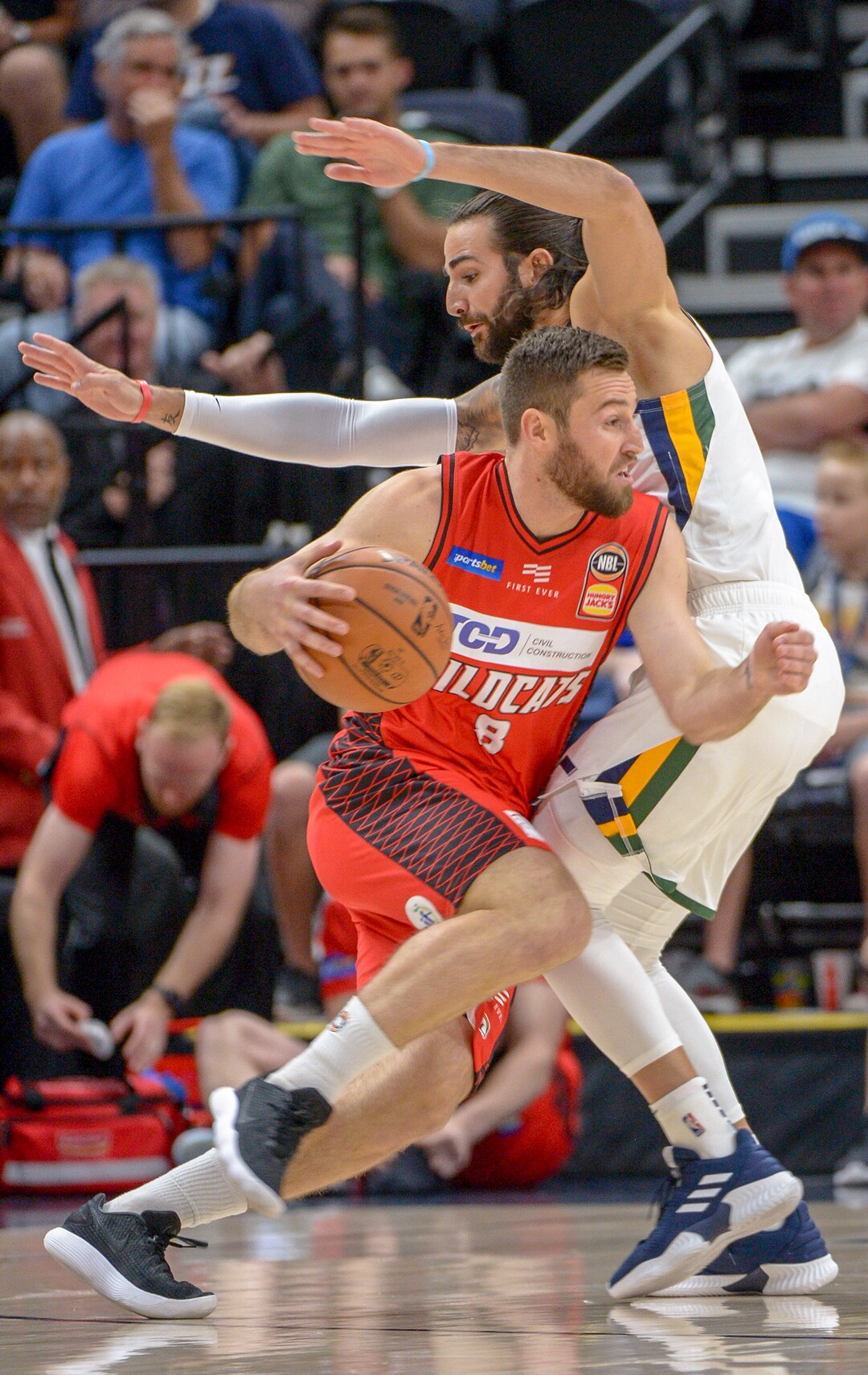 Leah Hogsten  |  The Salt Lake Tribune   Perth Wildcats guard Mitch Norton (8) pushes past Utah Jazz guard Ricky Rubio (3) as the Utah Jazz host the Perth Wildcats, Sept. 29, 2018 at Vivint Smart Home Arena.