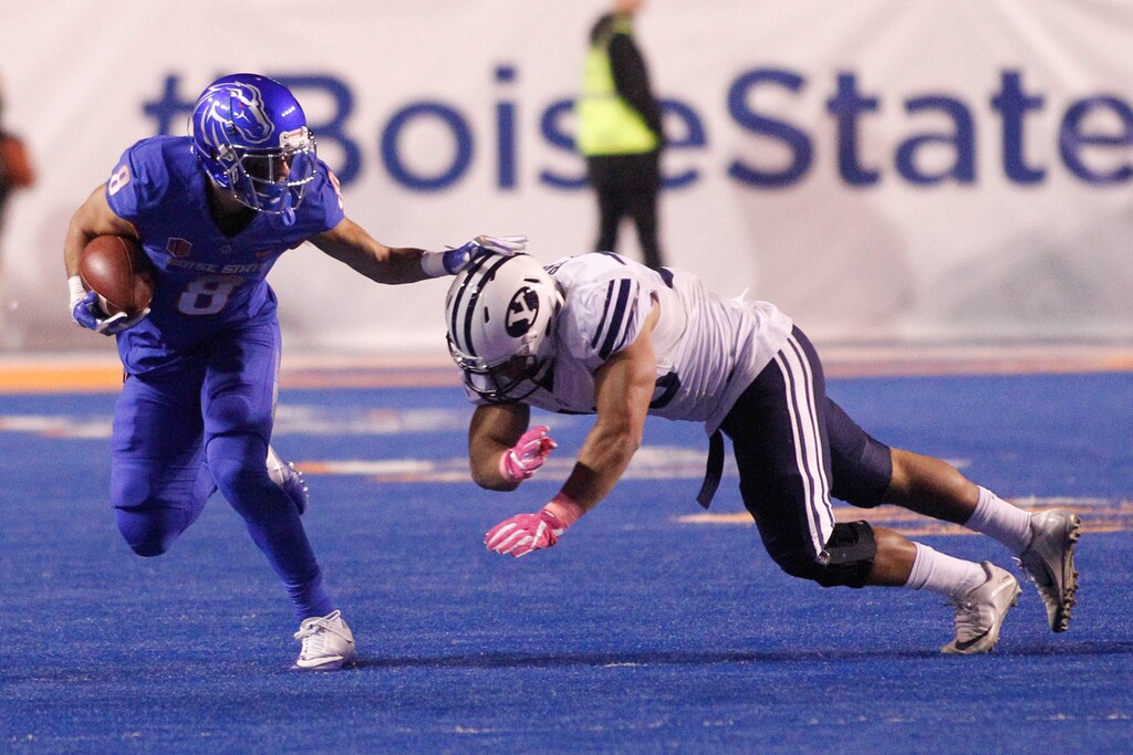Boise State wide receiver Sean Modster (8) runs the ball against BYU linebacker Butch Pau'u during the second half of an NCAA college football game in Boise, Idaho, Thursday, Oct. 20, 2016. Boise State won 28-27. (AP Photo/Otto Kitsinger)