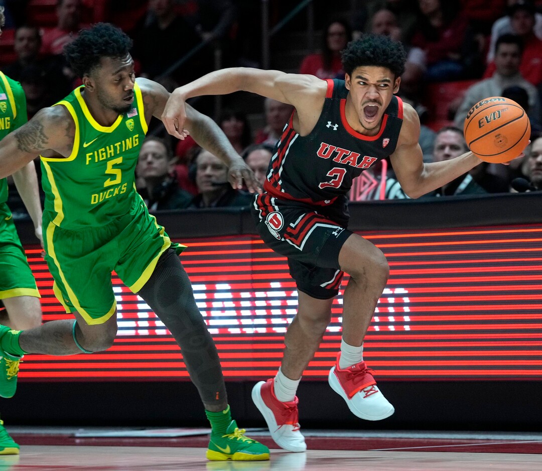 (Leah Hogsten | The Salt Lake Tribune) Utah Utes forward Bostyn Holt (3) gets the fast break and the foul on Oregon Ducks guard Jermaine Couisnard (5) as the University of Utah hosts Oregon at the Huntsman Center, Jan. 7, 2023.