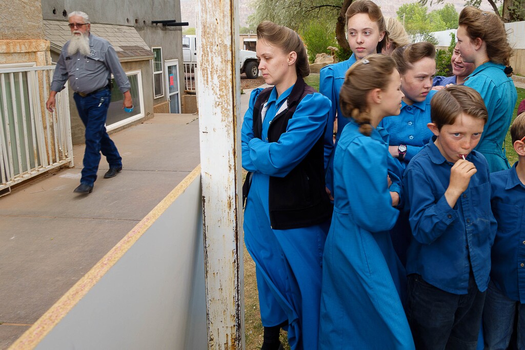 Trent Nelson  |  The Salt Lake Tribune
A group of FLDS women and children look on as Mohave County Constable Mike Hoggard and the UEP Trust change the locks on their Colorado City, Ariz., home, Tuesday, May 9, 2017.