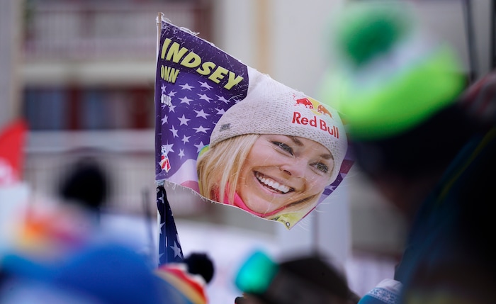 Supporters hold a flag with a portrait of United States' Lindsey Vonn in the finish area prior to the start of the women's downhill race, at the alpine ski World Championships in Are, Sweden, Sunday, Feb. 10, 2019. (AP Photo/Giovanni Auletta)