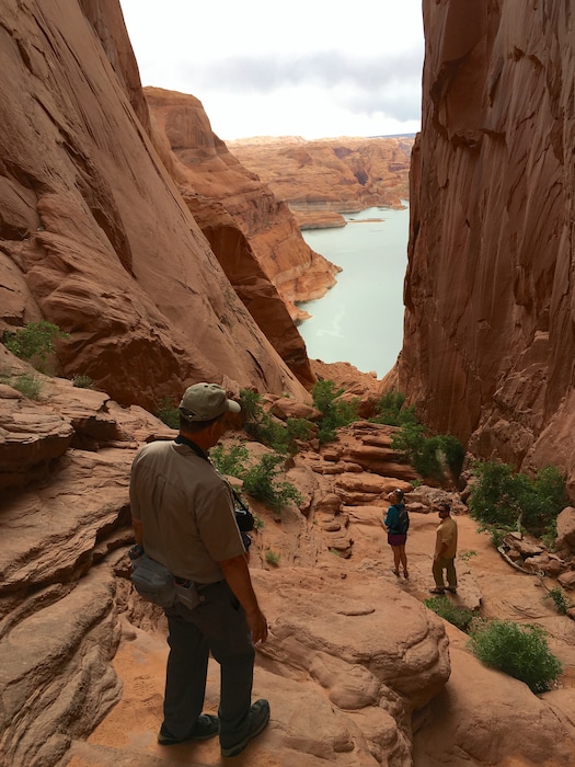 (File photo courtesy of National Park Service) Steve Henry, a Nation Park Service backcountry ranger, visits Hole in the Rock, the famous trail cut by a Mormon pioneer expedition to reach San Juan County in 1880, along with anthropologist Katie Brown and Erik Stanfield, a cultural  resource specialist for Glen Canyon National Recreation Area. Utah officials have been interested in developing a new state park in part of Garfield County to commemorate the San Juan Expedition and enable bigger groups to visit. Now, a  proposal in Congress would transfer Hole In The Rock Road, the road to the area, to the state of Utah.