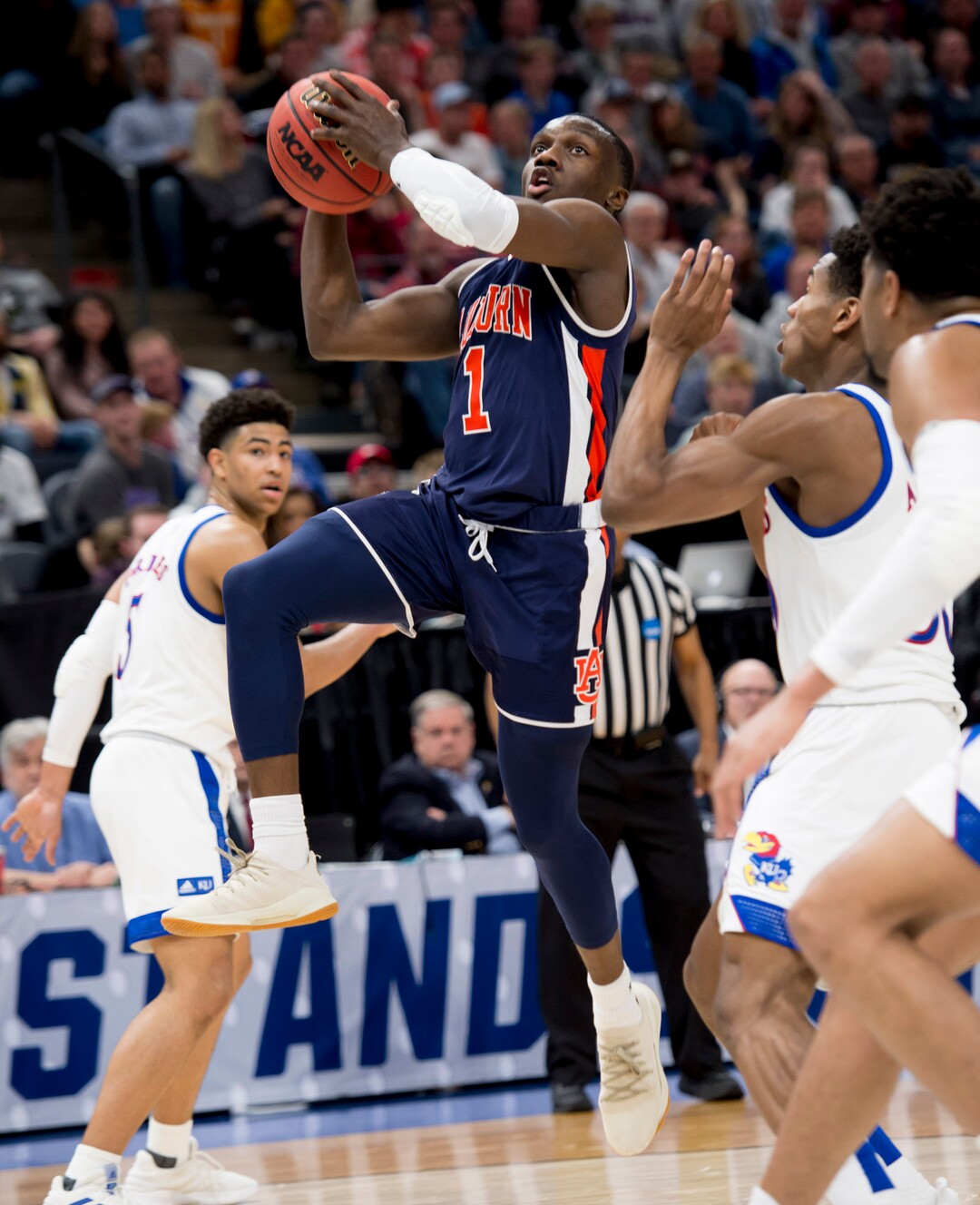 (Leah Hogsten  | The Salt Lake Tribune)  Auburn Tigers guard Jared Harper (1) drives to the basket as Auburn faces Kansas in the second round of the NCAA tournament in Salt Lake City on Saturday, March 23, 2019.