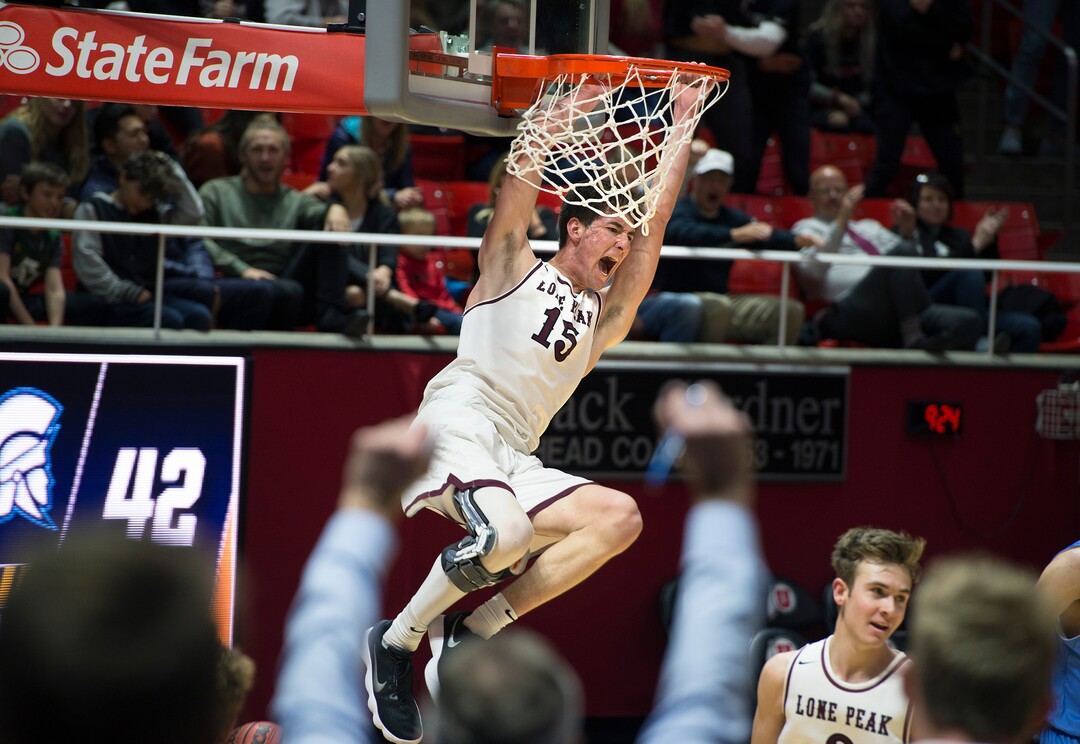 Scott Sommerdorf | The Salt Lake TribuneLone Peak's Jackson Pollard yells as he dunks late in the second half as Lone Peak beat Layton 82-47, in a boy's 6A semi-final, FrIday, March. 2, 2018.