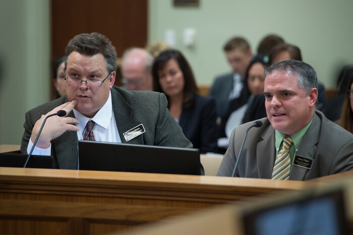 (Scott Sommerdorf   |  The Salt Lake Tribune)   
David Gibson, left, and Brian Dean of the Office of the Legislative Auditor General listen to questions during the Legislative Audit Committee's hearing on a "Performance Audit of Juvenile Justice Services", Thursday, January 25, 2018.