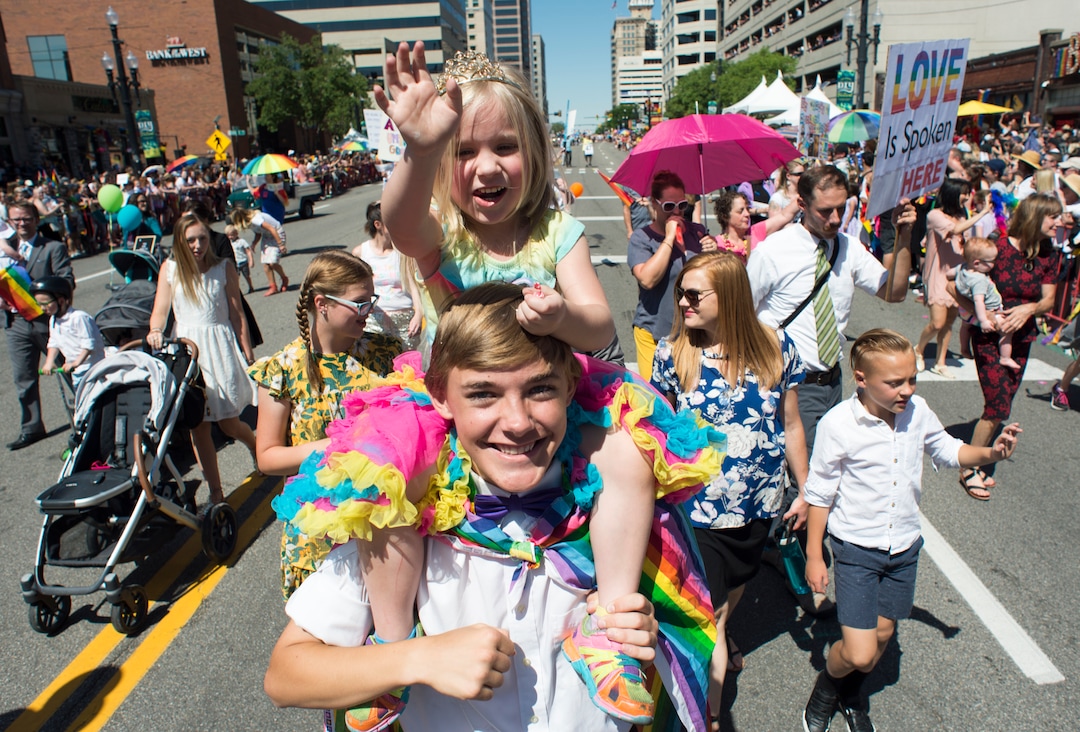 (Rick Egan  |  The Salt Lake Tribune)    Eowin Dillon, 4, rides on the shoulders of her brother, Cendan Dillon 15, as they walk with Mormons Building Bridges, in the Utah Pride Parade in Salt Lake City, Sunday, June 3, 2018.