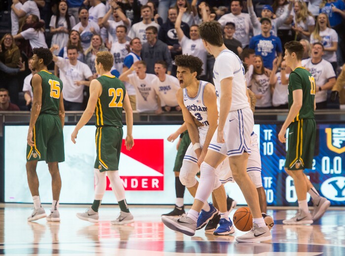 (Rick Egan  |  The Salt Lake Tribune)  Brigham Young Cougars guard Elijah Bryant (3) celebrates after tying the game 65-65 in the finals seconds of regulation, sending the game into overtime, in basketball action at the Marriott Center, Saturday, February 10, 2018.