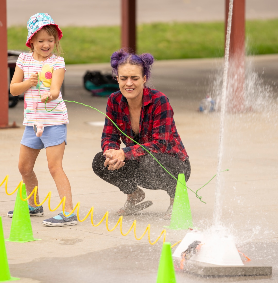 (Rick Egan | The Salt Lake Tribune) Talya Buhler and her mother Katlyn Buhler launch a hand-made rocket at the14th annual Craft Lake City DIY FEST, at the Fair Park, Aug. 13, 2022. 