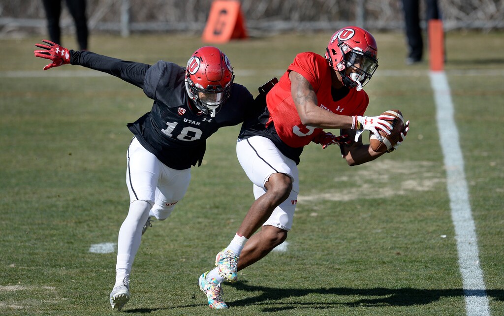 Scott Sommerdorf | The Salt Lake Tribune file photo
Utah WR Demari Simpkins catches a pass behind DB Nygel King during Utah spring football practice, Saturday, March 10, 2018.
