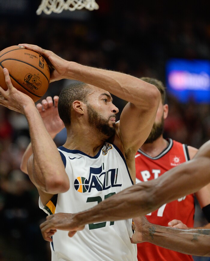 (Francisco Kjolseth  |  The Salt Lake Tribune)  Utah Jazz center Rudy Gobert (27) tries to regain control over the Raptors in the first half of the preseason NBA game at Vivint Smart Home Arena Tuesday, Oct. 2, 2018, in Salt Lake City.