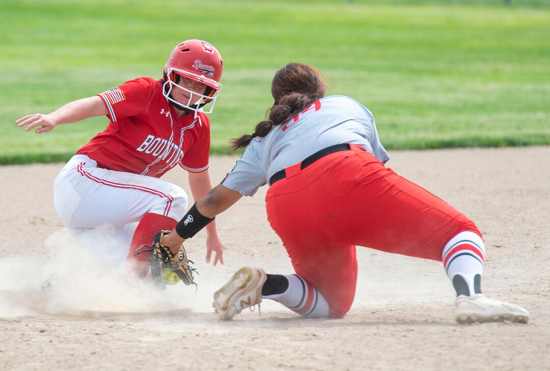 (Rick Egan  |  The Salt Lake Tribune)     Libbie Hawker slides safely into second base as West high short stop Huntyr Ava puts on a tag, in 5A state championship action between the West High Panthers and the Bountiful Braves, in Taylorsville, Thursday May 30, 2019