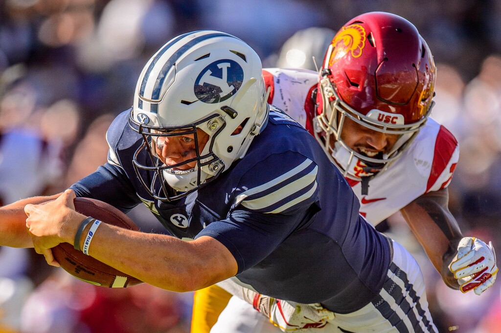 (Trent Nelson  |  Tribune file photo) Brigham Young Cougars quarterback Zach Wilson (1) dives for a late touchdown as BYU hosts USC, NCAA football in Provo on Saturday, Sept. 14, 2019.