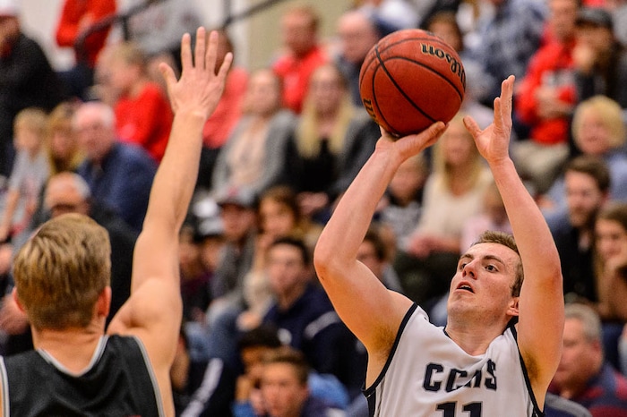 (Trent Nelson | The Salt Lake Tribune)  Corner Canyon's Ammon Jensen (11) hits a three-pointer as Corner Canyon faces Bountiful in the title game of the Corner Canyon Tournament of Champions, high school boys' basketball in Draper, Saturday December 2, 2017.