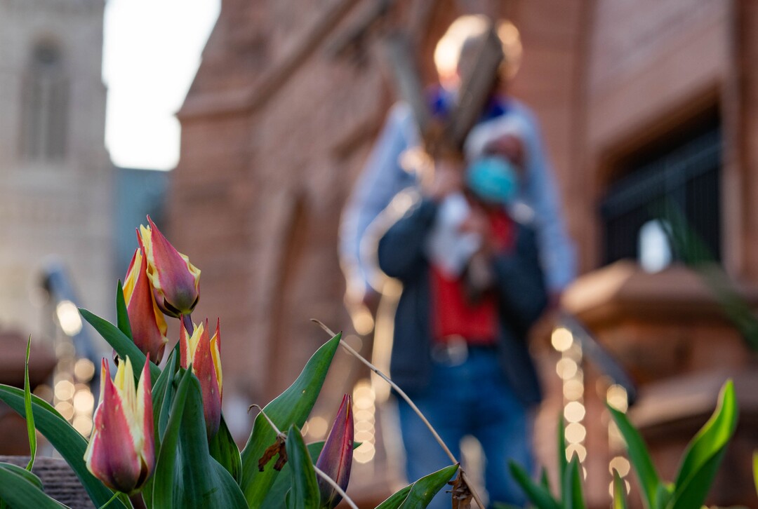 (Francisco Kjolseth  | The Salt Lake Tribune) Mask wearing Utah Christians walk the streets of Salt Lake City beginning at Cathedral of the Madeleine on Good Friday, to symbolically mark Jesus' carrying the cross to his crucifixion, April 2, 2021.