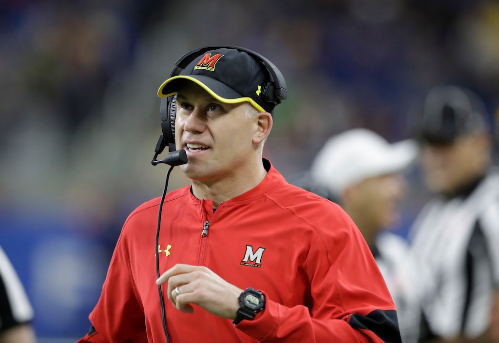 FILE - In this Dec. 26, 2016, file photo, Maryland head coach DJ Durkin walks the sideline during the first half of the Quick Lane Bowl NCAA college football game against Boston College in Detroit. Maryland placed the head of the football team's strength and conditioning staff on paid leave while it investigates claims he verbally abused and humiliated players, a person briefed on the situation said. The person spoke to The Associated Press on Saturday, Aug. 11, 2018, on condition of anonymity because Maryland had not announced the decision regarding Rick Court. The person says athletic director Damon Evans spoke with the football team Saturday morning and Durkin was still leading the program.  (AP Photo/Carlos Osorio, File)