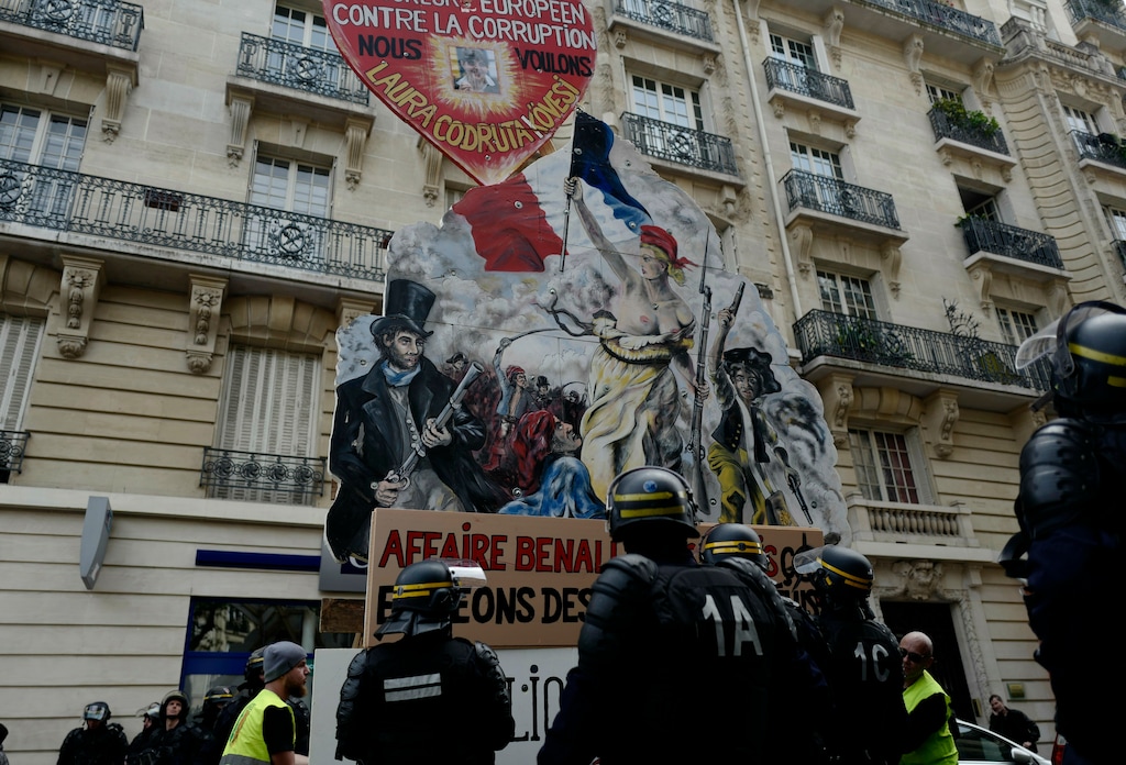 (Kamil Zihnioglu | AP photo)
Protestors wheel a French revolution themed giant placard during a May Day demonstration in Paris, Wednesday, May 1, 2019. French authorities announced tight security measures for May Day demonstrations, with the interior minister saying there was a risk that "radical activists" could join anti-government yellow vest protesters and union workers in the streets of Paris and across the country.