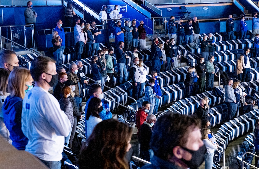 (Isaac Hale | Special to The Tribune) Fans stand for the national anthem just before a game between the BYU Cougars and the Saint Mary’s College of California Gaels held at the Marriott Center in Provo on Saturday, Feb. 27, 2021.