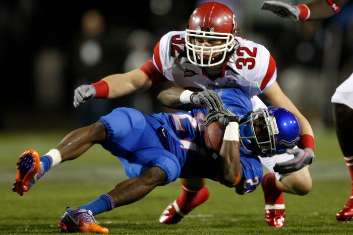 (Chris Detrick  |  Tribune File Photo)  Utah Utes linebacker Chaz Walker #32 tackles Boise State Broncos running back Jeremy Avery #27 during the first half of the Maaco Bowl at Sam Boyd Stadium Wednesday December 22, 2010. Boise State is winning the game 16-3.