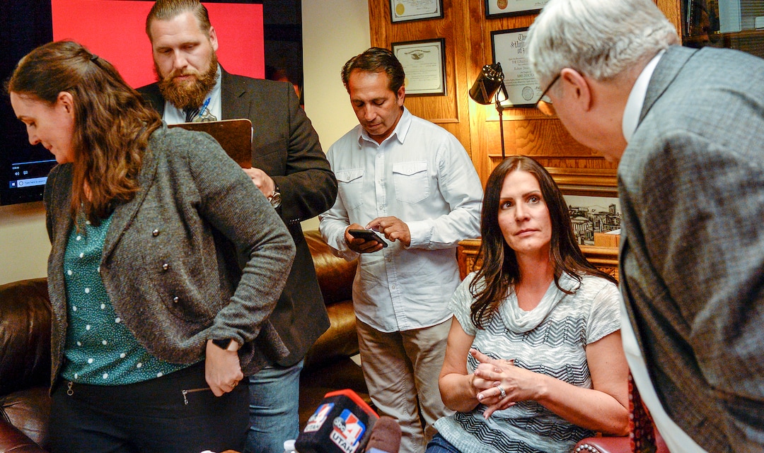 Leah Hogsten  |  The Salt Lake Tribune   Brenda Mayes, right, talks with her attorney Robert Sykes, right, after a press conference with the media announcing the lawsuit they filed, Tuesday, May 7, 2019 against the Davis School District, accusing a bus driver of racial discrimination against her son. l-r Co-counsel Alyson McAllister, Pete Sorensen and MayesÕ fiance, Terry Martinez also attended.