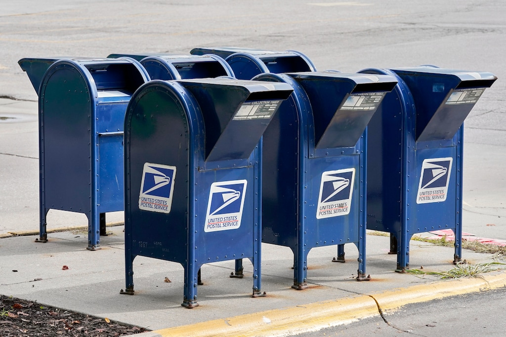 (Nati Harnik | AP) Mailboxes in Omaha, Neb., Tuesday, Aug. 18, 2020. The Postmaster general announced Tuesday he is halting some operational changes to mail delivery that critics warned were causing widespread delays and could disrupt voting in the November election. Postmaster General Louis DeJoy said he would "suspend" his initiatives until after the election "to avoid even the appearance of impact on election mail."