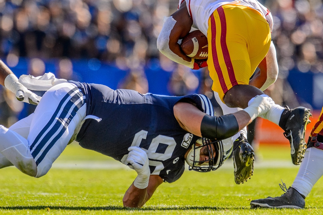 (Trent Nelson  |  The Salt Lake Tribune)  Brigham Young Cougars defensive lineman Zac Dawe (99) stops USC Trojans running back Stephen Carr (7) as BYU hosts USC, NCAA football in Provo on Saturday Sept. 14, 2019.