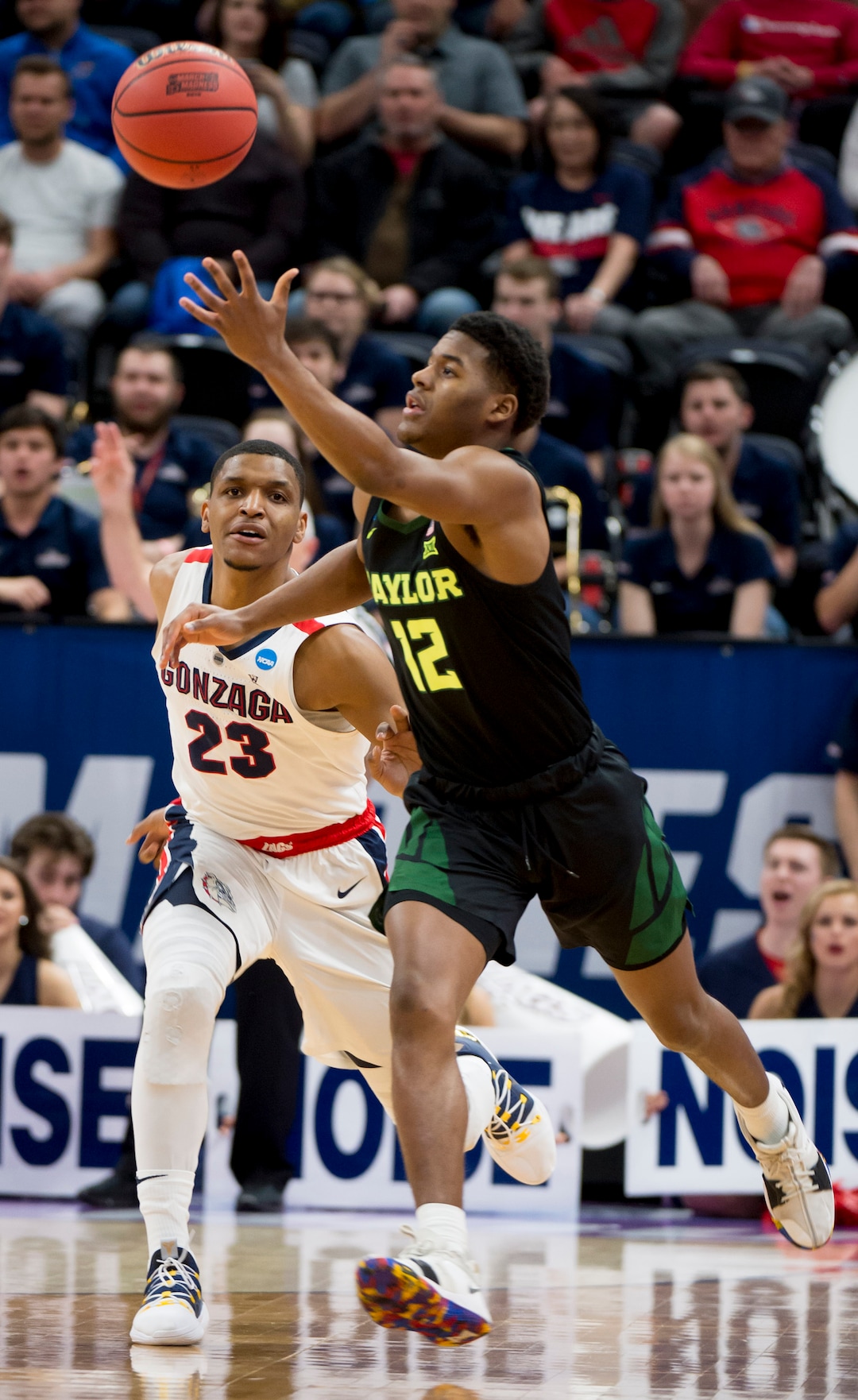 (Leah Hogsten  | The Salt Lake Tribune)  Baylor Bears guard Jared Butler (12) goes for the ball under pressure from Gonzaga Bulldogs guard Zach Norvell Jr. (23) as Baylor faces Gonzaga in the second round of the NCAA tournament in Salt Lake City on Saturday, March 23, 2019.