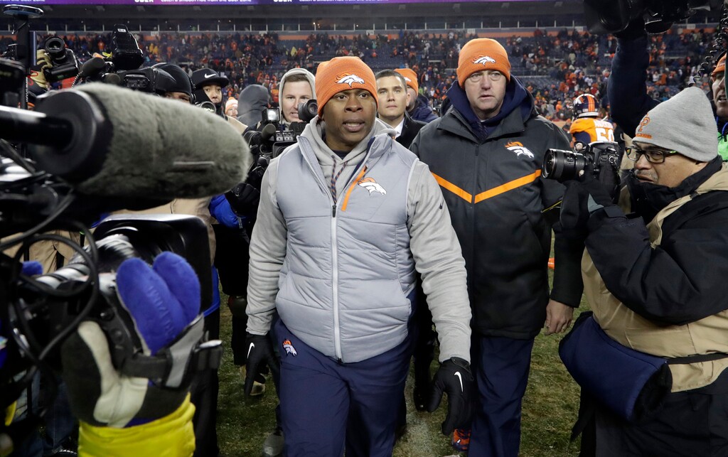 Denver Broncos coach Vance Joseph walks off the field after the team's 27-24 loss to the Kansas City Chiefs during an NFL football game Sunday, Dec. 31, 2017, in Denver. (AP Photo/Joe Mahoney )