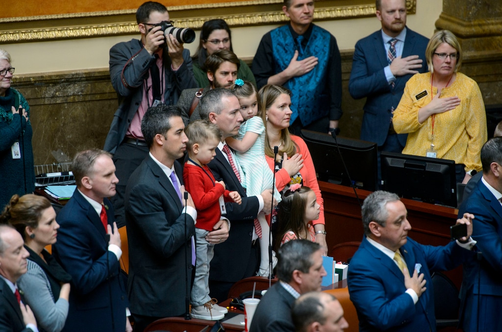 (Steve Griffin  |  The Salt Lake Tribune) Members of the House of Representatives, their family members and staff stand for the singing of the National Anthem as the 2018 Legislative session begins at the Utah State Capitol in Salt Lake City Monday January 22, 2018.