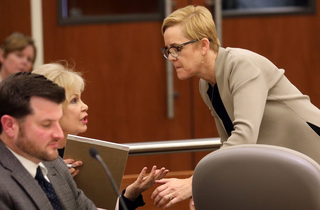 Deputy Salt Lake County attorney Bridget K. Romano, right, speaks with her client Salt Lake County Clerk Sherrie Swensen, left, as Judge James D. Gardner hears arguments in Third District Court Thursday Nov. 15, 2018, in West Jordan, Utah. A Utah judge has reserved a decision on a lawsuit in a tight House race filed by a Republican incumbent who is seeking to halt vote counting in a Democratic-leaning county that's key to the outcome. Judge James Gardner heard arguments Thursday in the lawsuit filed by U.S. Rep Mia Love, but ended the hearing without making a ruling. (AP Photo/Rick Bowmer, Pool)