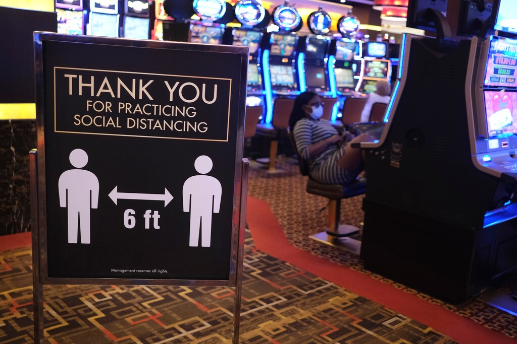 (Seth Wenig | AP file photo) A sign asks people to practice social distancing the Golden Nugget Casino in Atlantic City, N.J., Thursday, July 2, 2020.