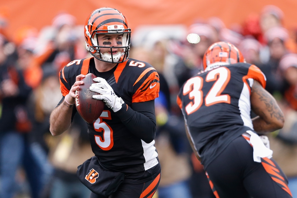 Cincinnati Bengals quarterback AJ McCarron (5) looks to pass in the first half of an NFL football game against the Baltimore Ravens, Sunday, Jan. 3, 2016, in Cincinnati. (AP Photo/Gary Landers)