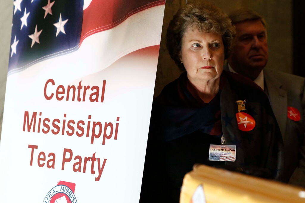 (Rogelio V. Solis | AP photo) Laura Van Overschelde, a state tea party activist and a FreedomWorks member, listens as other speakers, call for Gov. Phil Bryant to appoint state Sen. Chris McDaniel, R-Ellisville, to the U.S. Senate seat Thad Cochran will vacate April 1, at the Capitol in Jackson, Miss., Wednesday, March 14, 2018.