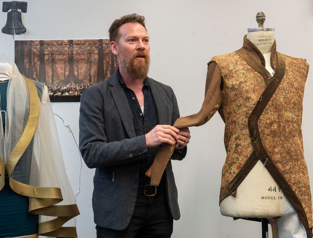 (Rick Egan  |  The Salt Lake Tribune) "Project Runway" alum Bradon McDonald shows some of his original designs during a preview event for "Norma," at the Utah Opera Production Studios, Monday, April 15, 2019.