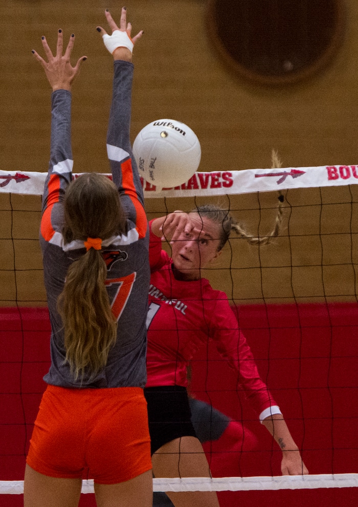(Rick Egan  |  The Salt Lake Tribune)  Baylee Mittelstaedt (1) hits the ball for Bountiful, as Brinley Watkins (17) defends for Skyridge, in volleyball action, Bountiful vs. Skyridge, at Bountiful High, Wednesday, September 6, 2017.