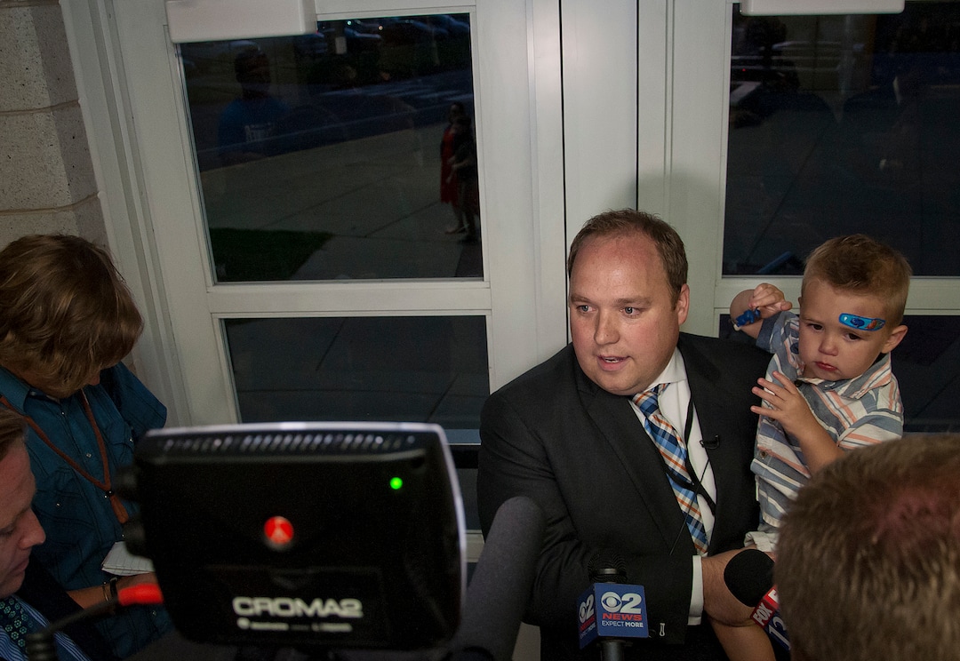 (Michael Mangum  |  Special to the Tribune)  Adam Gardiner, holding his son Mason, 1, speaks to the media following his election as Salt Lake county recorder during the recorder election at the county republican Central Committee Meeting at Jordan High School in Sandy, UT on Thursday, August 17, 2017.