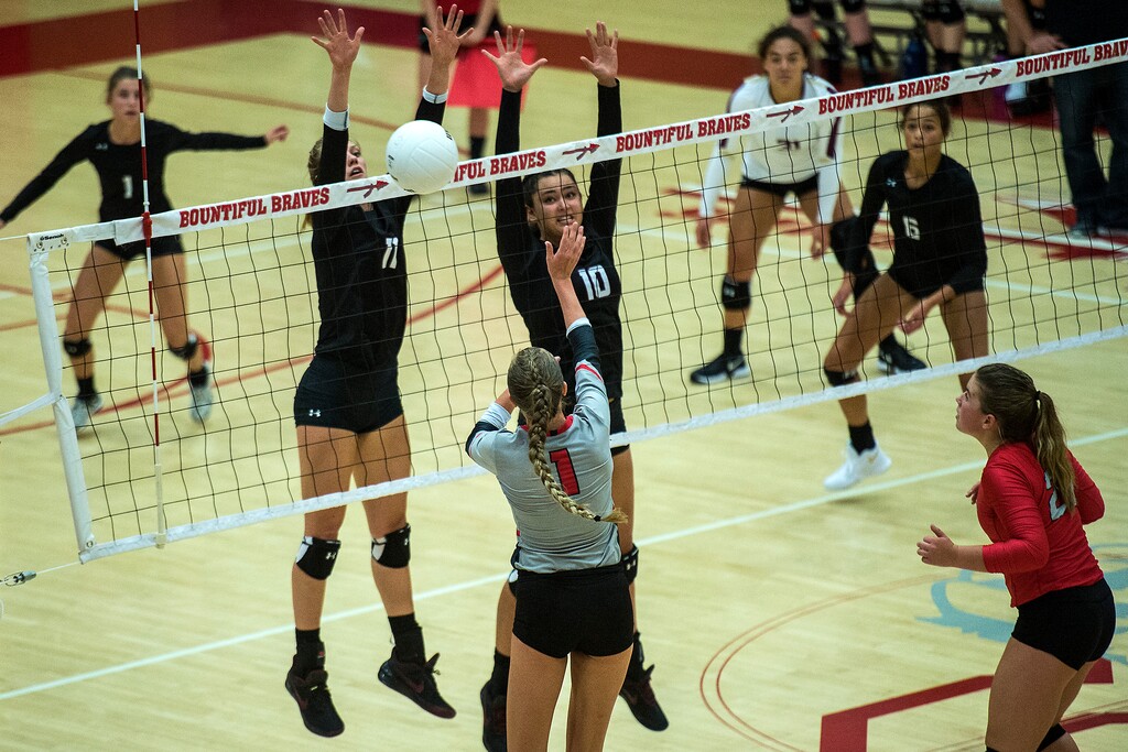 (Chris Detrick  |  The Salt Lake Tribune)  Lone Peak's Kennedi Boyd (10) and Lone Peak's Jaquelyn LanghaimÊ(11) go up to block Bountiful's Baylee Mittelstaedt (1) during the volleyball match at Bountiful High School Tuesday, September 12, 2017. 