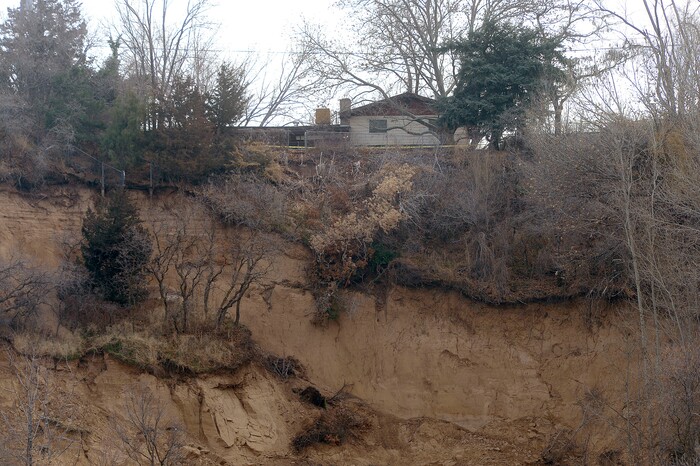 (Al Hartmann | The Salt Lake Tribune)
Unstable slope beneath house near 4860 S. 600 W. in Riverdale Wednesday Nov. 29. Four houses in a row whose backyard's facing west, with railroad tracks and the Weber River Parkway below have been evacuated due to a landslide.