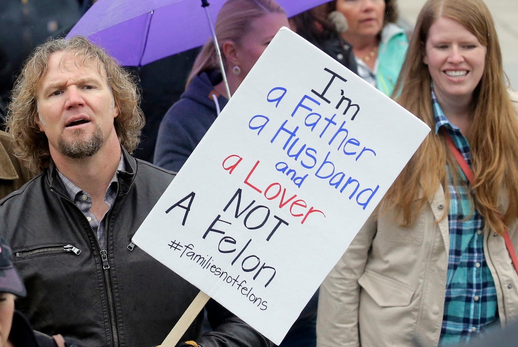 (Rick Bowmer | AP Photo) This Feb. 10, 2017 photo, Kody Brown, left, from TV's reality show "Sister Wives," marches during a protest at the state Capitol, in Salt Lake City. Practicing polygamy in Utah is no longer a felony crime for the first time in 85 years under a bill that passed the Legislature on Friday, Feb. 28, 2020.