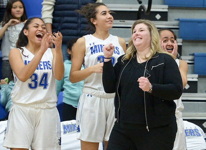 (Leah Hogsten  |  The Salt Lake Tribune) Bingham's head coach Charron Mason and the team celebrate the win in the final minute.  Bingham defeated Copper Hills 48-40 in their semifinal game of the 6A High School Girls' Basketball Tournament at SLCC in Taylorsville, Friday, Feb. 23, 2018. 